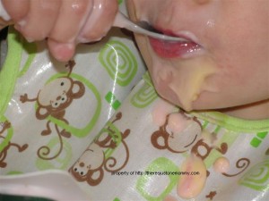 toddler eating yogurt