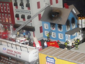 burning house in train display