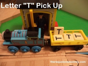 using toy trains to teach about the letter T