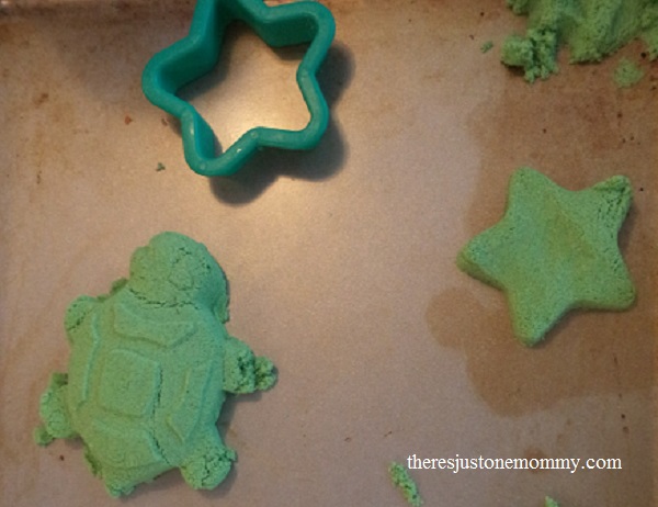 playing with kinetic sand