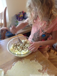 mixing ingredients for apple pie