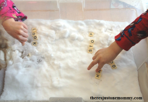 working on spelling and sight words using tiles in the snow