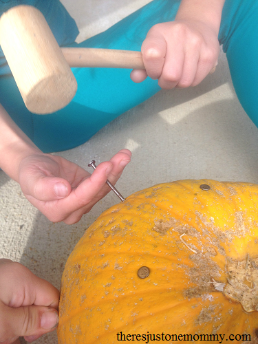 fall proprioceptive activity for kids -- hammering nails in pumpkins