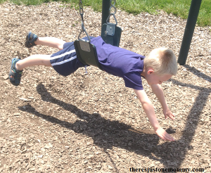 using a playground swing to strengthen core muscles in kids