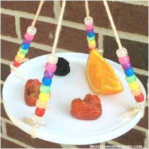 simple beaded butterfly feeder made with plastic lid