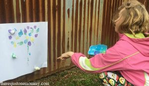 cotton ball splat painting -- fun and messy outdoor art for kids